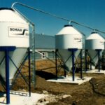 Feed bins and systems